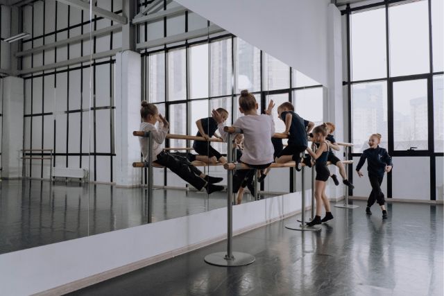 kids play around in a dance studio