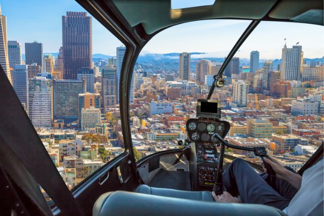 a helicopter flies over a city